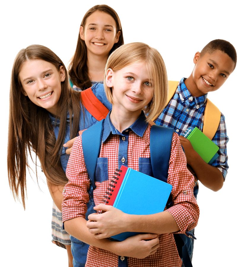 Four smiling students wearing backpacks, one girl holding notebooks in front