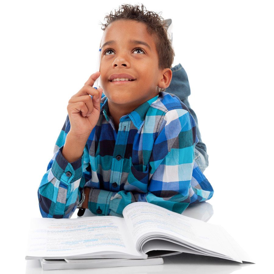 Boy in a plaid shirt looking up thoughtfully with a finger on his chin, an open book in front of him